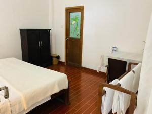Postel nebo postele na pokoji v ubytování I Surf Weligama + 21 fotografií