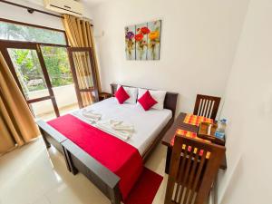 Postel nebo postele na pokoji v ubytování The Kandy Havens