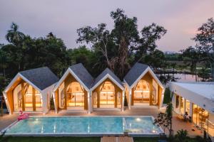 an image of a house with a swimming pool at Winvilla Pattaya - Private Pool Villa 5 Bedrooms in Na Jomtien
