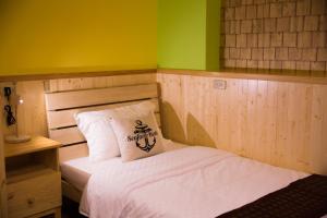 Uma cama ou camas num quarto em 輕旅小站 Soft Travel Hostel