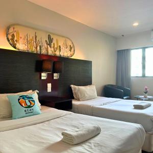 מיטה או מיטות בחדר ב-Greenage MingSuite 明绿时代套房 Kota Kinabalu 亚庇市中心