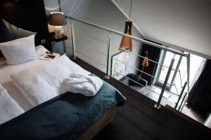 a bedroom with a bed and a window with at Scandic Front in Copenhagen