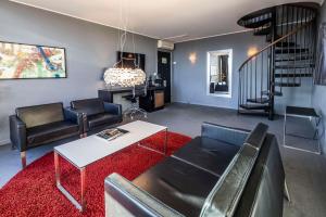 a living room with a couch and a table at Scandic Front in Copenhagen