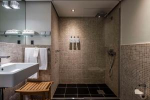 a bathroom with a sink and a shower at Scandic Front in Copenhagen