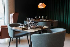 a table with wine glasses on it in a restaurant at Scandic Simonkenttä in Helsinki