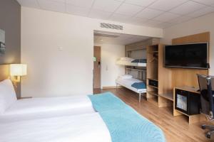 Postel nebo postele na pokoji v ubytování Scandic Asker
