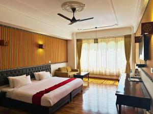 Ένα ή περισσότερα κρεβάτια σε δωμάτιο στο Hotel Migmar