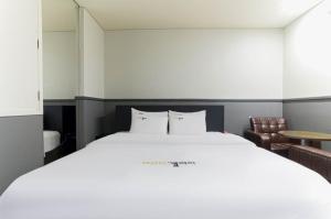 Pyeongtaek Gallery Hotel客房内的一张或多张床位