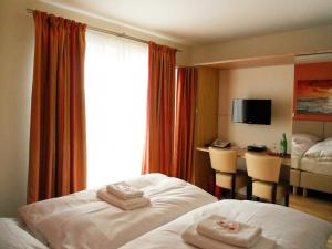 Postel nebo postele na pokoji v ubytování Seehotel Lönö