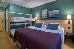 Tempat tidur dalam kamar di Scandic Lugnet