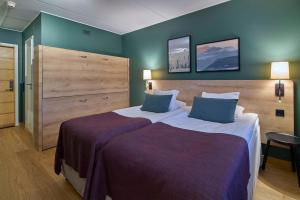 Tempat tidur dalam kamar di Scandic Lugnet