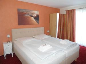 Postel nebo postele na pokoji v ubytování Seehotel Lönö