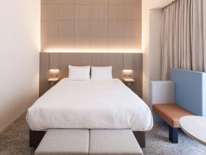 En eller flere senge i et værelse på HOTEL IL PALAZZO - Vacation STAY 68269v + 15 billeder