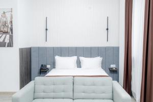 Postel nebo postele na pokoji v ubytování INFINITY PLAZA BLOCK 1