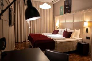 Postel nebo postele na pokoji v ubytování Scandic Grand Central