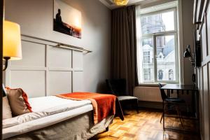 Postel nebo postele na pokoji v ubytování Scandic Grand Central