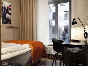 Postel nebo postele na pokoji v ubytování Scandic Grand Central