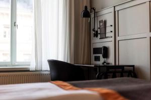 Postel nebo postele na pokoji v ubytování Scandic Grand Central