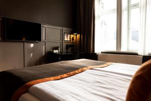 Postel nebo postele na pokoji v ubytování Scandic Grand Central
