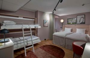 A bed or beds in a room at Scandic Klara