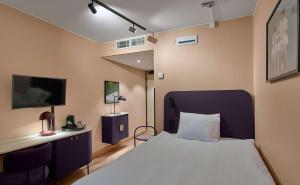 A bed or beds in a room at Scandic Klara