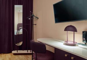 A television and/or entertainment centre at Scandic Klara