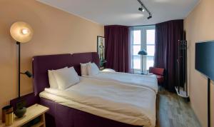 A bed or beds in a room at Scandic Klara