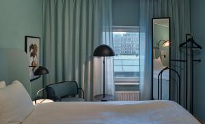 A bed or beds in a room at Scandic Klara