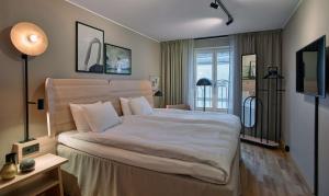 A bed or beds in a room at Scandic Klara