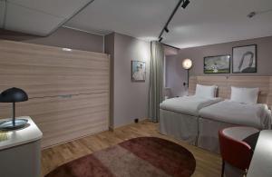 A bed or beds in a room at Scandic Klara