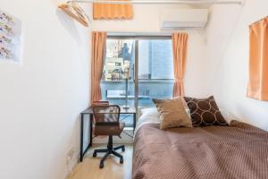 Postel nebo postele na pokoji v ubytování 夢の宿 翼 132t