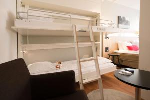 Postel nebo postele na pokoji v ubytování Scandic Sundsvall City