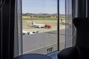 a view of an airport runway with planes on the tarmac at Scandic Stavanger Airport in Sola