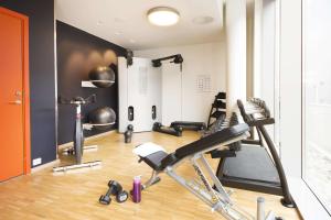a gym with cardio equipment in a room at Scandic Stavanger Airport in Sola