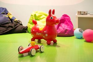 a toy chicken and a toy car on a table at Scandic Stavanger Airport in Sola