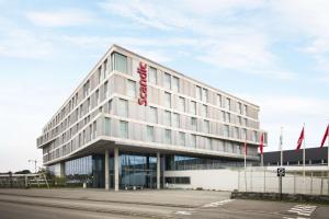 a building with a sign on the front of it at Scandic Stavanger Airport in Sola