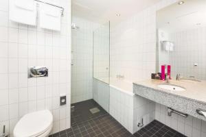 a bathroom with a toilet and a sink at Scandic Stavanger Airport in Sola