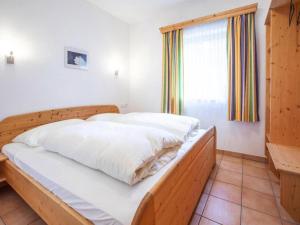 Posteľ alebo postele v izbe v ubytovaní Chalet in Filzsteinalpe near Ski Slopes