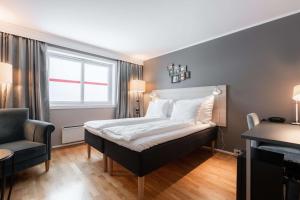 Postel nebo postele na pokoji v ubytování Scandic Bryggen