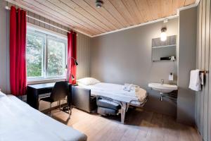 Postel nebo postele na pokoji v ubytování Scandic Karasjok