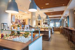 a buffet line in a restaurant with food on display at Scandic Seilet Hotel in Molde