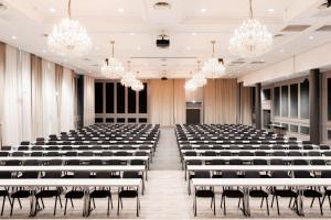 an empty conference room with chairs and chandeliers at Scandic Hell in Hell +37 photos