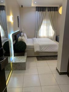 Postel nebo postele na pokoji v ubytování Centurion Aparthotel