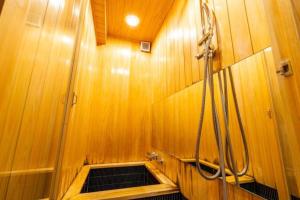 a bathroom with a shower and a sink at Kyoto Machiya inn offering scenic Kamo River views in Kyōto +41 photos