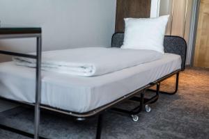 Postel nebo postele na pokoji v ubytování Scandic Sluseholmen