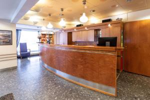 a large lobby with a bar in a courtroom at Scandic Kouvola in Kouvola