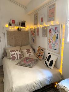 a bedroom with a bed with lights on it at Studio in historical monument in city center in Montpellier