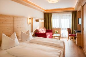 Voodi või voodid majutusasutuse Hotel Tyrol am Haldensee toas