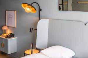 Postel nebo postele na pokoji v ubytování Scandic CPH Strandpark