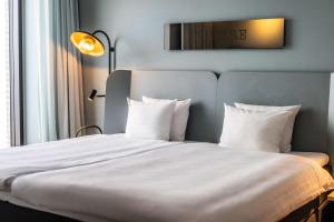 Postel nebo postele na pokoji v ubytování Scandic CPH Strandpark